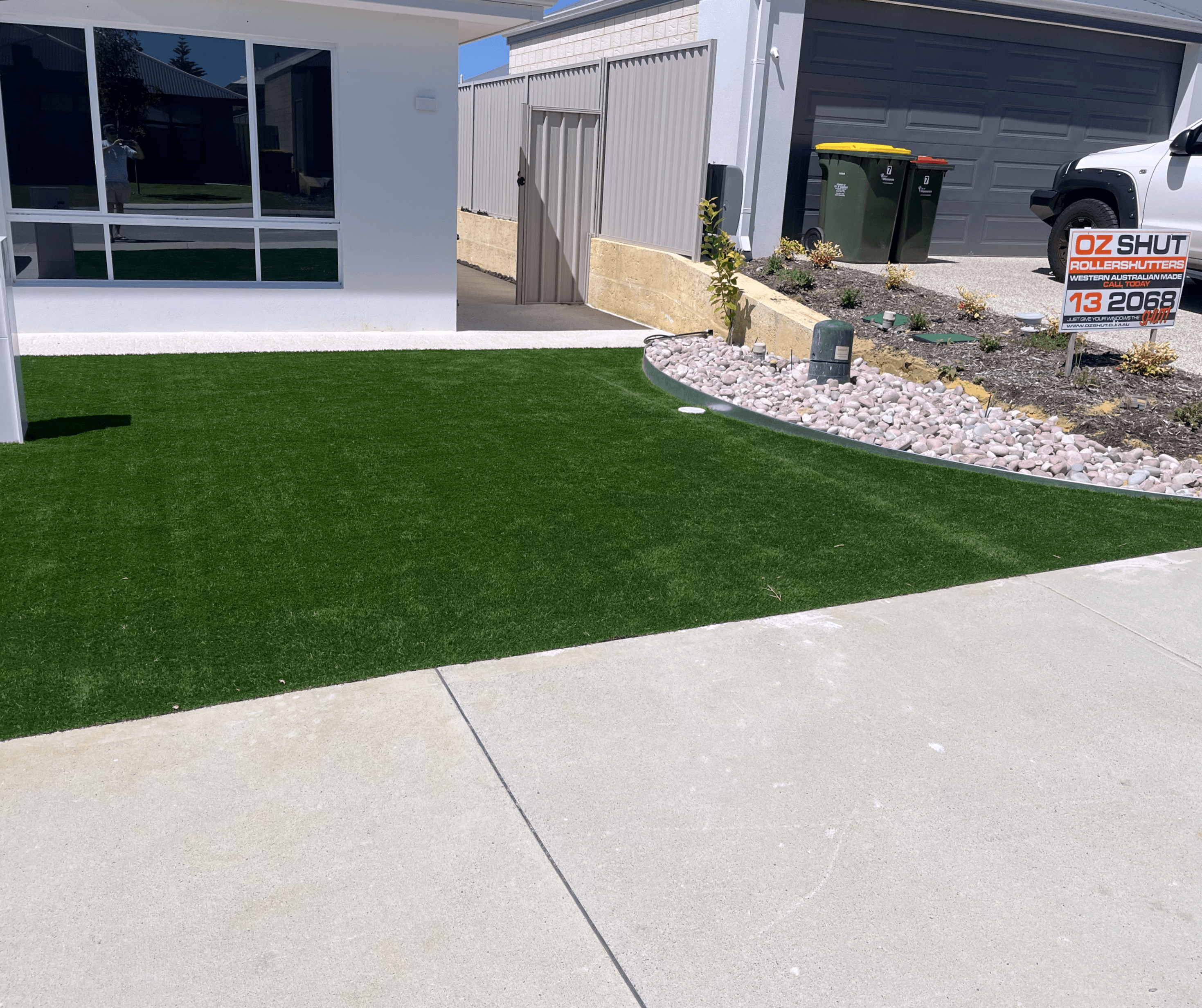 Artificial front lawn and a gravel garden bed on a new build